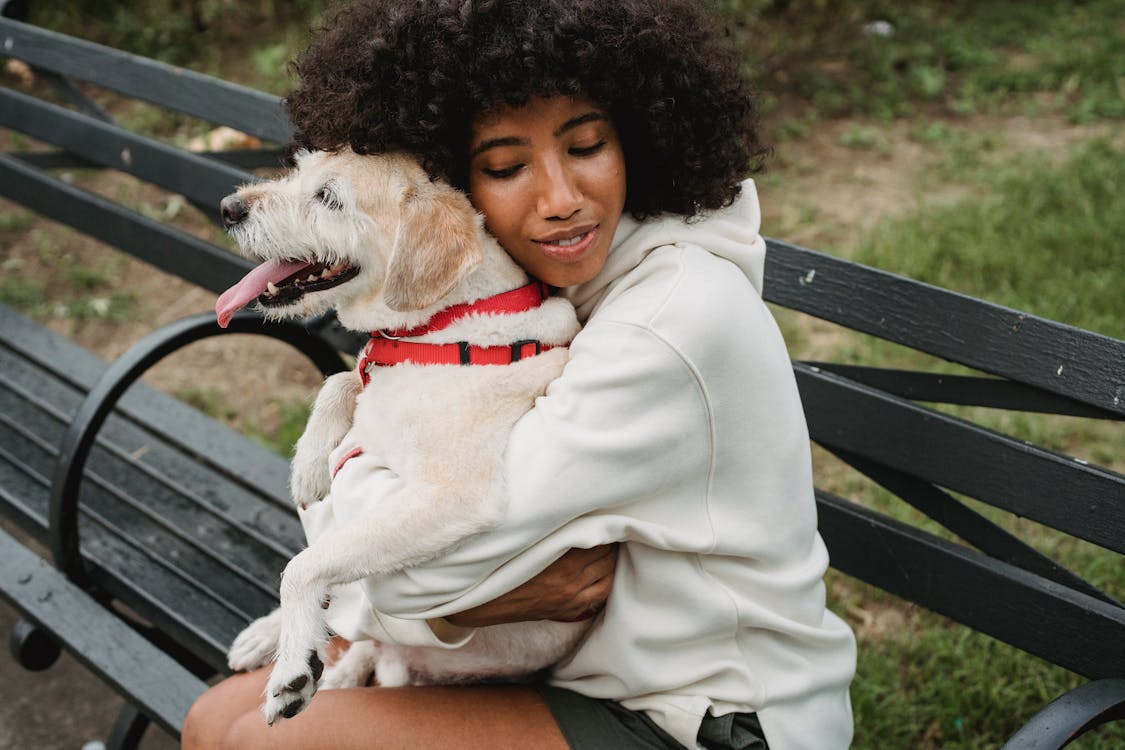 Woman Hugging Her Dog // Healthier Pets Today