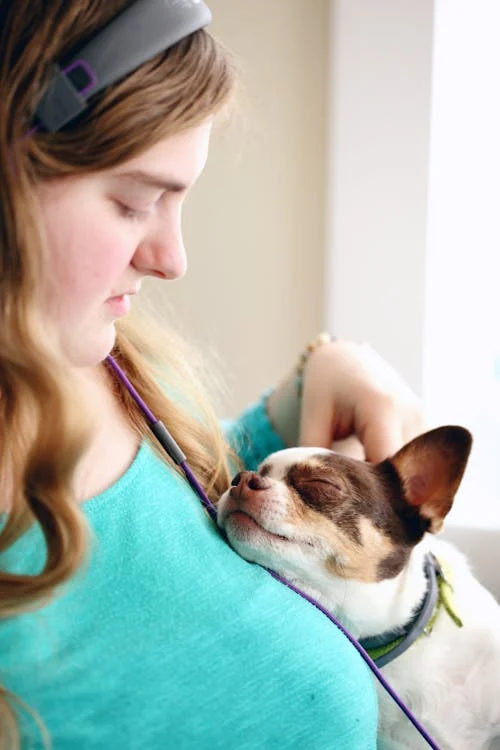 Pet Play, Woman Snuggling Her Dog // Healthier Pets Today