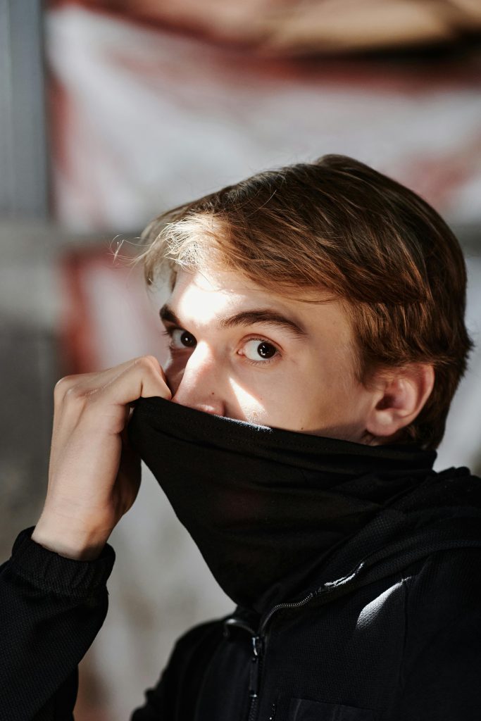 Close-Up Photo of a Man Covering His Mouth with a Black Cloth // Healthier Baby Today