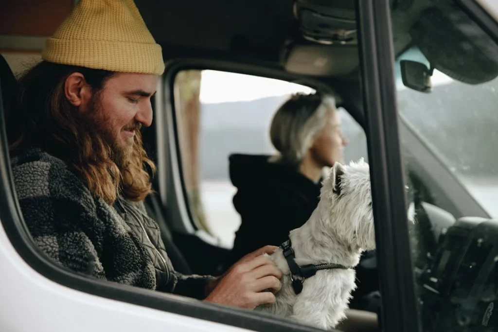 A Man with a Dog in a Car // Healthier Pets Today