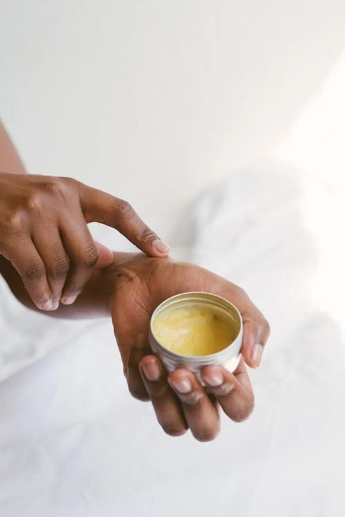 Person Holding A Hand Cream // Healthier Pets Today