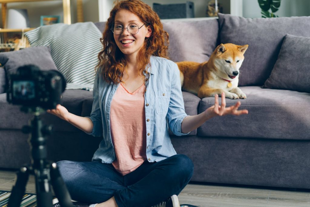 Smiling Woman Sitting on Floor in front of Camera // Healthier Pets Today