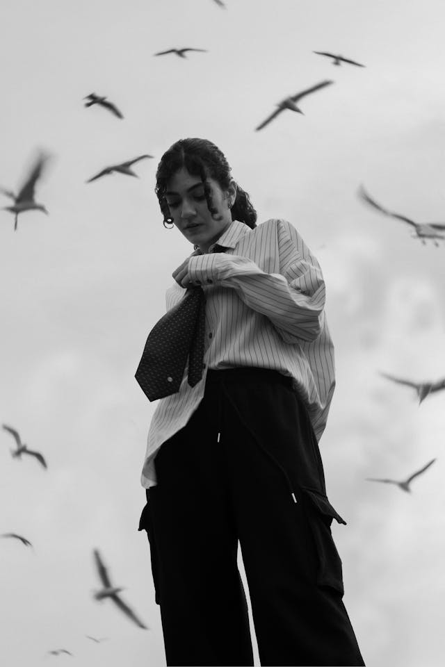 Woman Standing in Shirt with Tie and with Seagulls Flying around // Healthier Pets Today